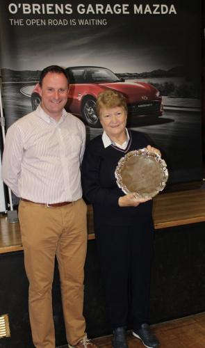 Catherine Mitchell (Sacred heart) receiving Division 2 Winners Shield from Roy Corbett, O'Briens Garage