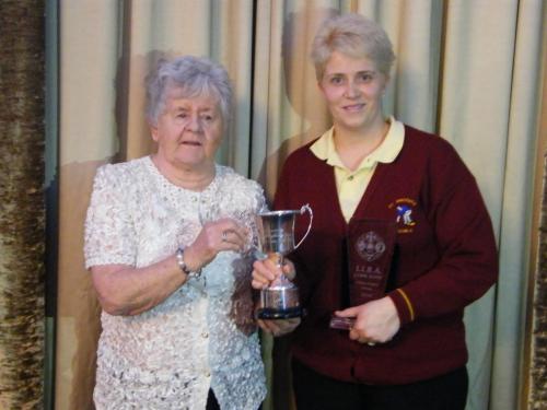 Noeleen Tanner St.Vincents winner Ladies Singles being presented with cup by Noreen O'Shaughnessy