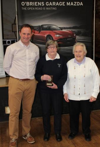 Betty Shellard (ICICYMA) receiving Division 3 runners up  Plaque from Roy Corbett, O'Briens Garage