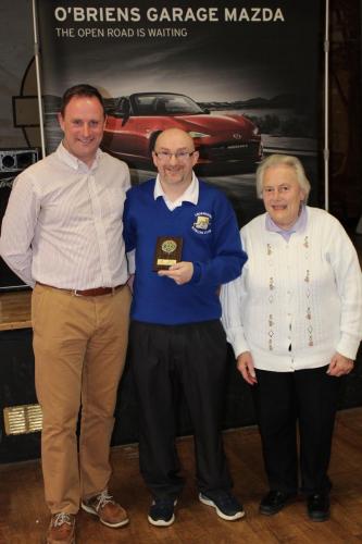 Keith Middleton (Crosshaven Green) receiving Division 1 runners up Plaque from Roy Corbett, O'Briens Garage