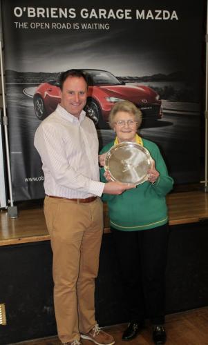 Marie Grace (Rockies Yellow) receiving Division 5 Winners Shield from Roy Corbett, O'Briens Garage
