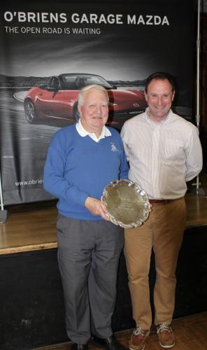 Eddie Mills (Barrs Yellow) receiving Division 3 Winners Shield from Roy Corbett, O'Briens Garage