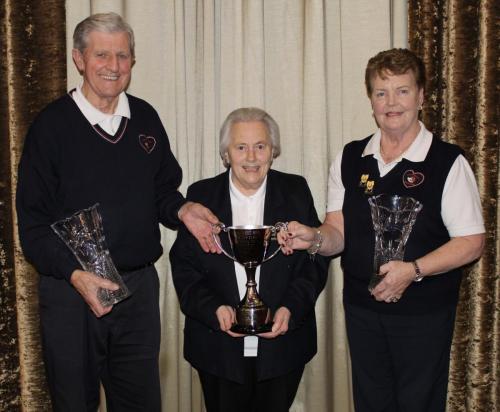 Peg & Chris Ahern Sacred Heart Over 70's Pairs winners receiving cup from Hazel Payne